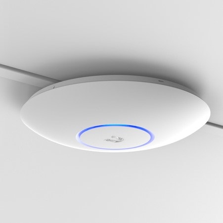 An image of Ubiquiti wireless access point.