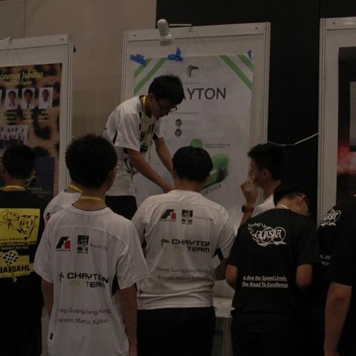 An image of me along with my team members decorating a booth at the Singapore F1 In Schools 2015 competition.